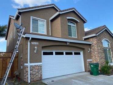 Brown colored independent house with a roof