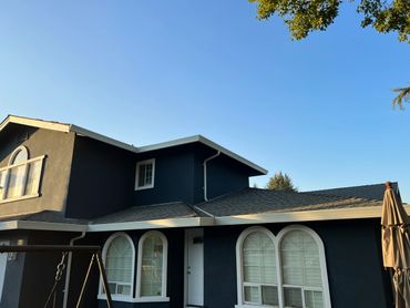 Black colored independent house with a roof