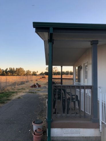 House with chairs outside the door