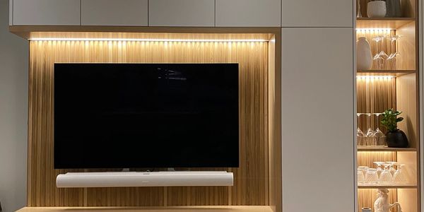 Modern white oak entertainment unit with shelving in High Park, Toronto