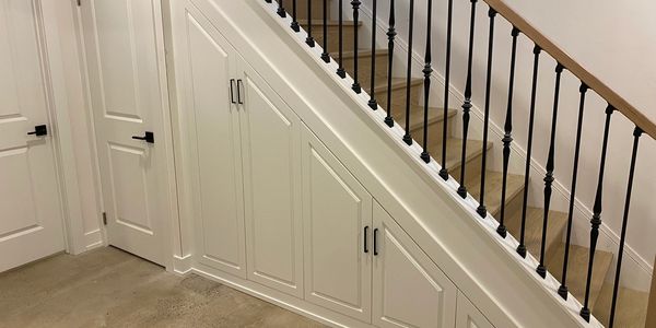Under stair cabinets with pantry pull outs in Leaside, Toronto.