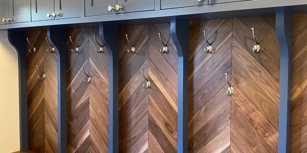 Traditional Mudroom with Live Edge Bench and Solid Walnut Chevron Paneling in Davisville, Toronto.