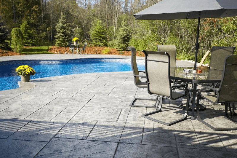 Picture of a backyard living space featuring a concrete patio.