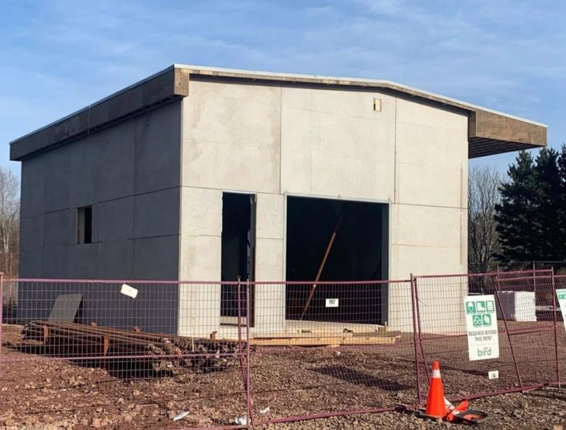 Photo of a precast panel building in mid-construction