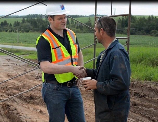 Photo of a contractor shaking hands with a Casey Concrete team member.