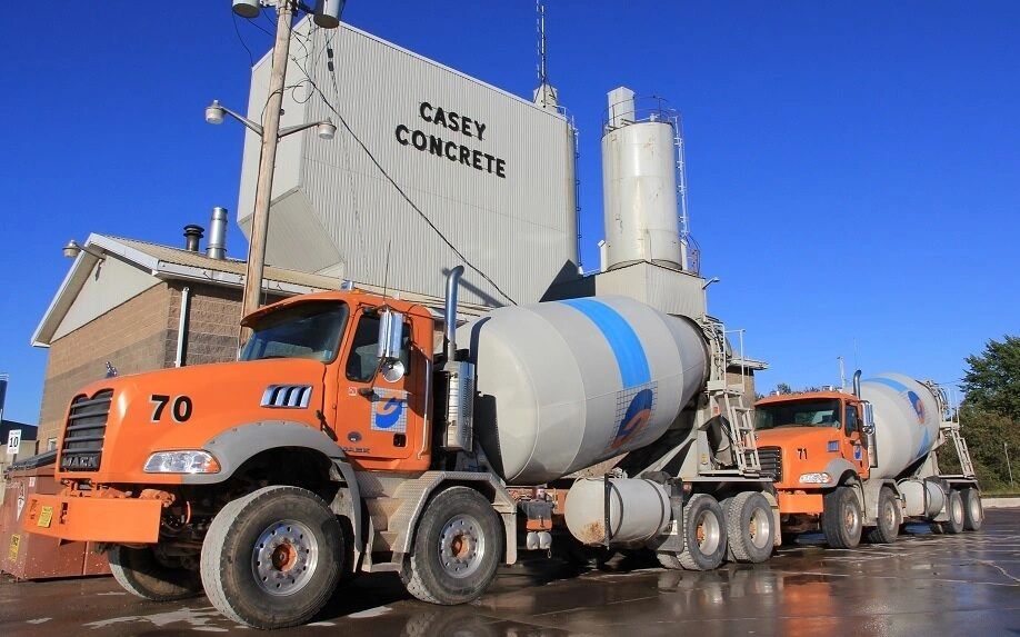 Ready-mix trucks in front of a batch plant