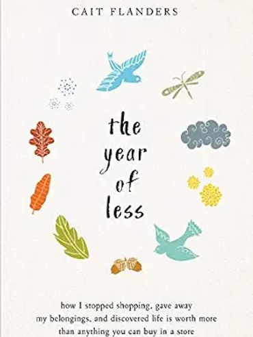 Book cover of 'The Year of Less' by Cait Flanders with nature illustrations.