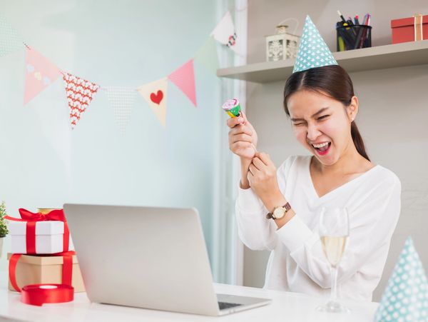 Asian woman count down and pull party popper to celebrate