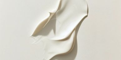 Smooth white cream texture on a white background.