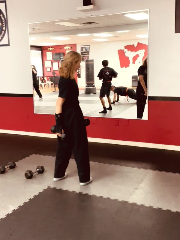 Lady working out in the Alpha Team fitness class.