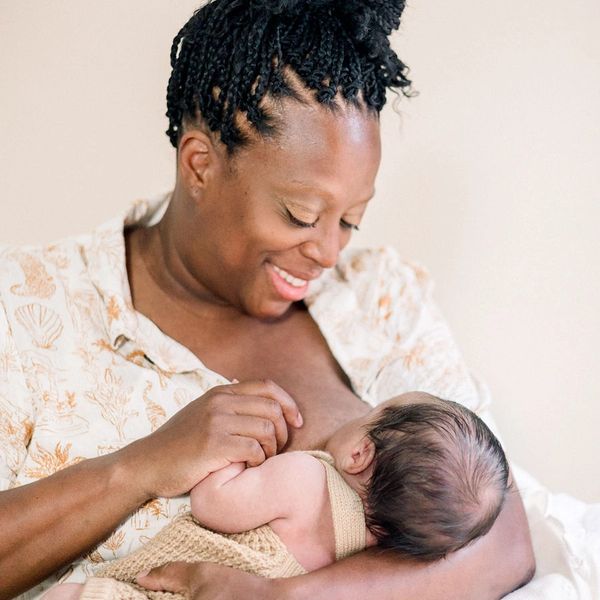 Mom breastfeeding her newborn at Mama Mentor's office in Augusta, GA