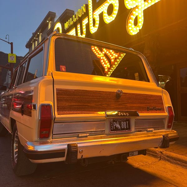 Grizzly Woody, restored 1988 Jeep Grand Wagoneer parked outside the Million Dollar Cowboy Bar in dow