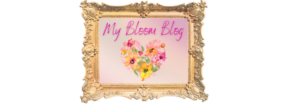 Elegant floral heart with 'My Bloom Blog' in ornate gold frame.