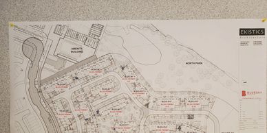 Architectural site plan showing layout of buildings and roads in a development area.