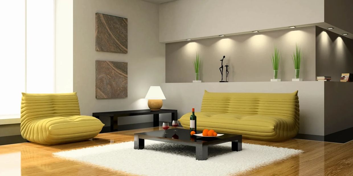 Modern living room with yellow seating, a low black coffee table, and decorative plants.