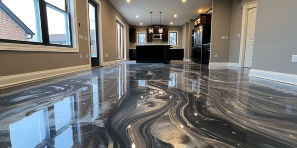 Metallic epoxy floor with glossy finish in home kitchen and dining area.
