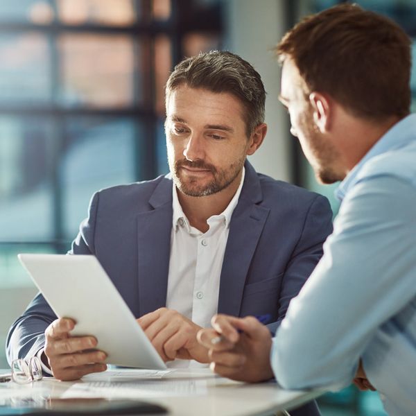 Two business men working together