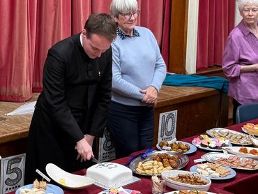 Fr. Thomas at the party after being installed as Priest in charge of St Andrew the Apostle and St Jo