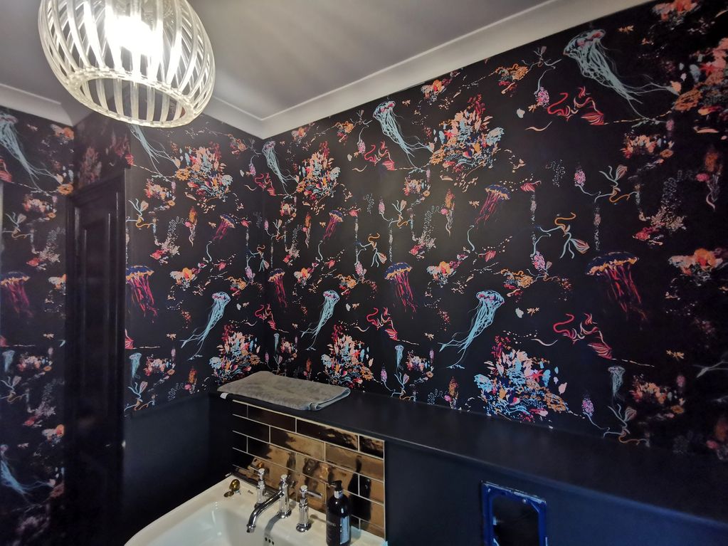 Wallpapering with black painted woodwork