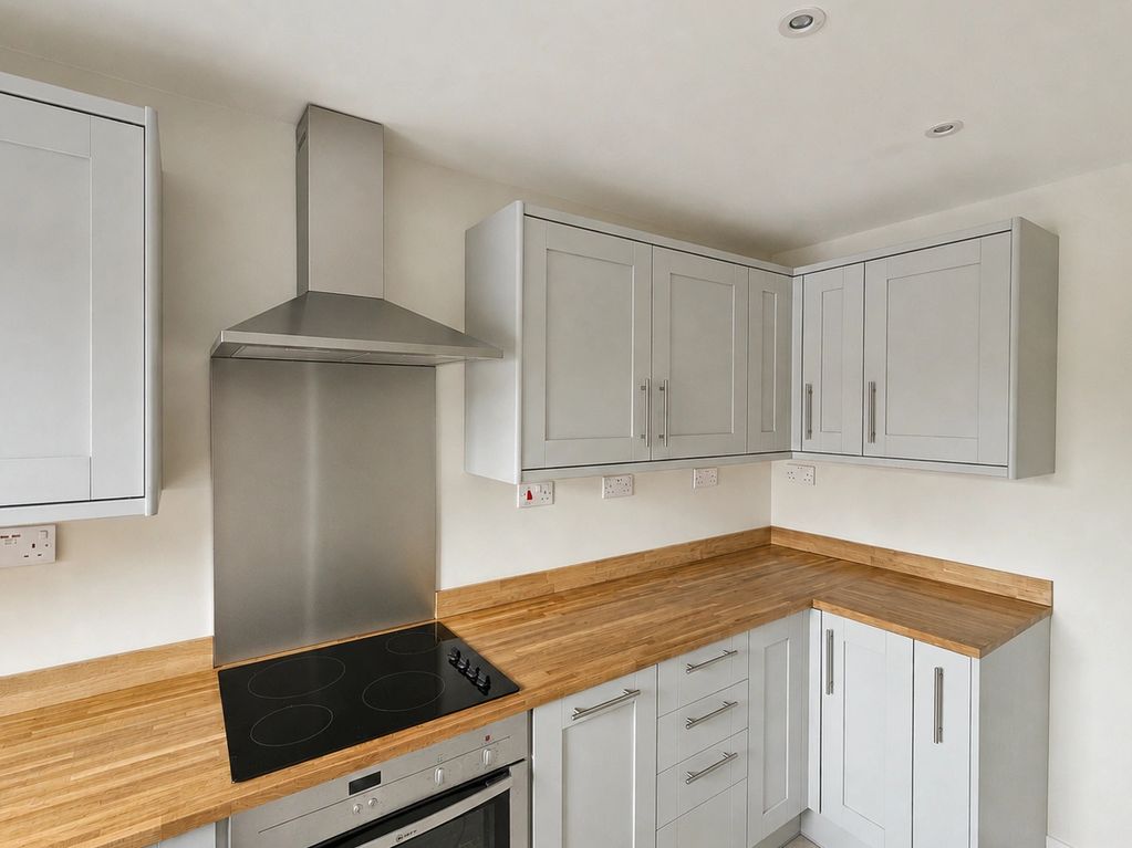 Bespoke Light Grey Kitchen with shaker style door, along with Natural Oak worktops