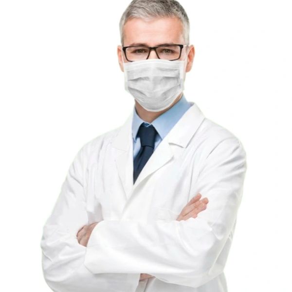 Male doctor wearing glasses and mask with arms crossed.
