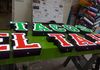 Channel letters on oversized raceway . Painted green 