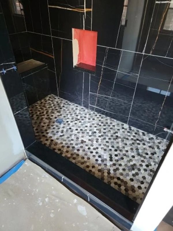 Beautiful black tile with hexagon floor tile. 