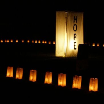 Luminaria dedication for those who have fought cancer