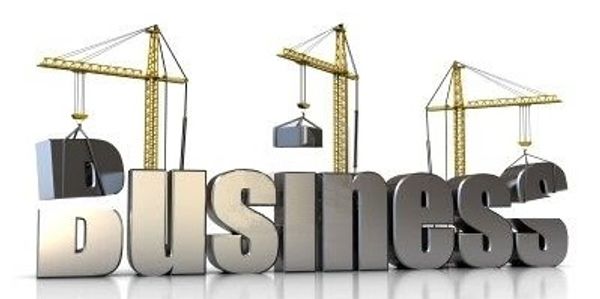 Cranes constructing the word 'Business' symbolizing growth.