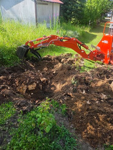 Digging out stumps with excavation services