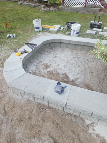 Building of a 7 foot by 14 foot old castle block Jr. with caps.