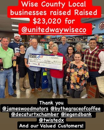 Group holding a large check celebrating $23,020 raised for United Way Wise County.