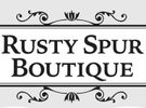 Elegant logo for Rusty Spur Boutique with decorative flourishes.