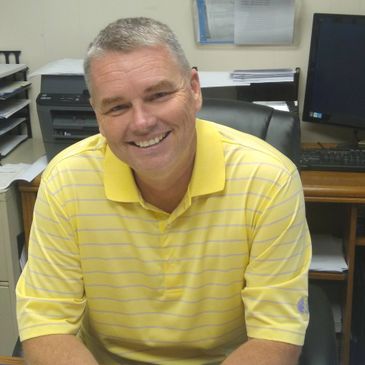 One of the owners of the company sitting at desk