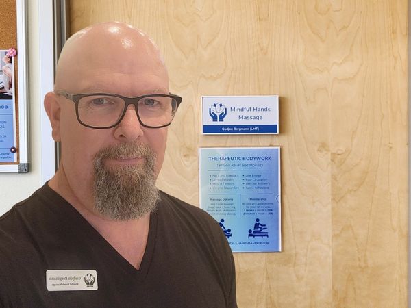 Gudjon Bergmann outside the Mindful Hands Massage office in San Marcos.