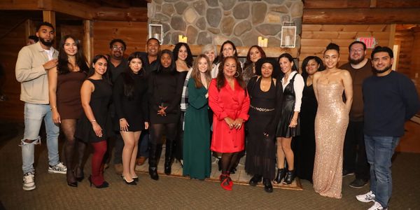 Group photo of people in formal and semi-formal attire.