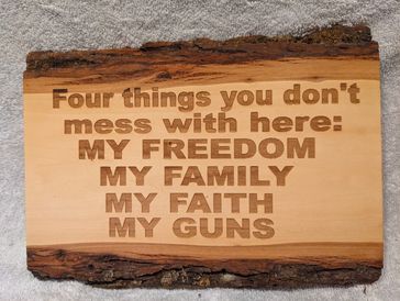 Wood engraved with Four things you don't mess with here: My Freedom | My Family | My Faith | My Guns