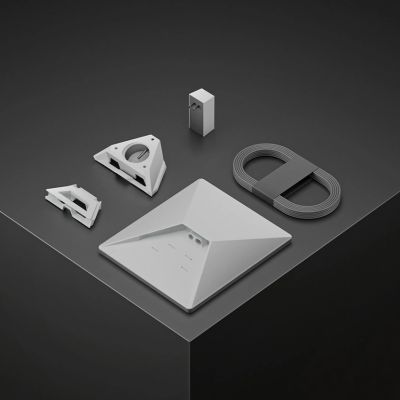 White and gray geometric 3D shapes on a dark surface.