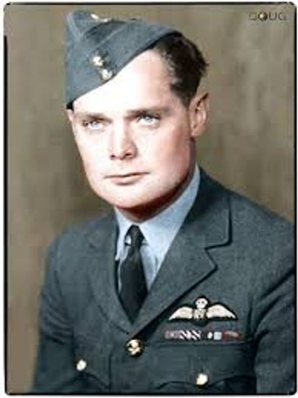 Portrait of a young man in a vintage military uniform with pilot wings.