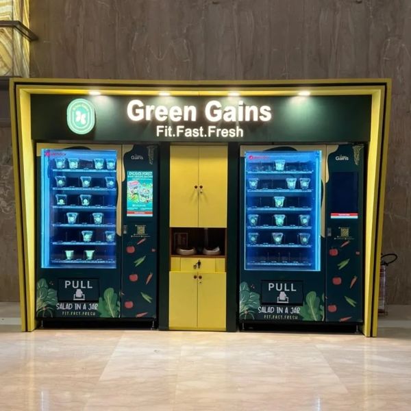 Green Gains vending machines offering fresh salad jars for a healthy lifestyle.