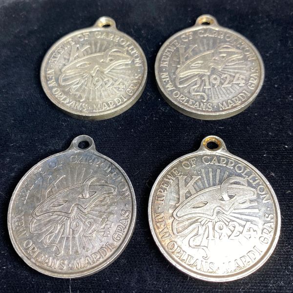 Four vintage New Orleans Mardi Gras Krewe of Carrollton 1924 medals.