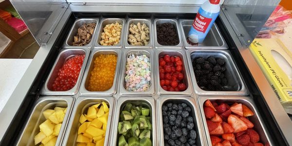 Some of our toppings. We have fruit, whipped cream, cookie dough, cheesecake bites, and more.