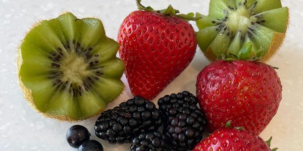 Strawberries, blackberries, blueberries, and kiwi. 