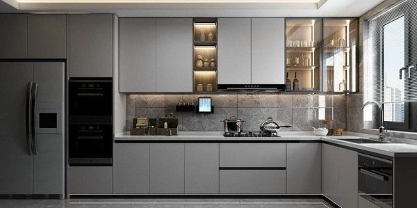 Modern kitchen with sleek grey cabinets and built-in appliances.