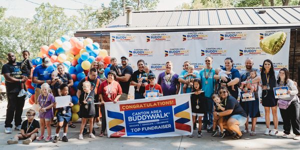Group photo at Canton Area Buddy Walk Top Fundraiser event.
