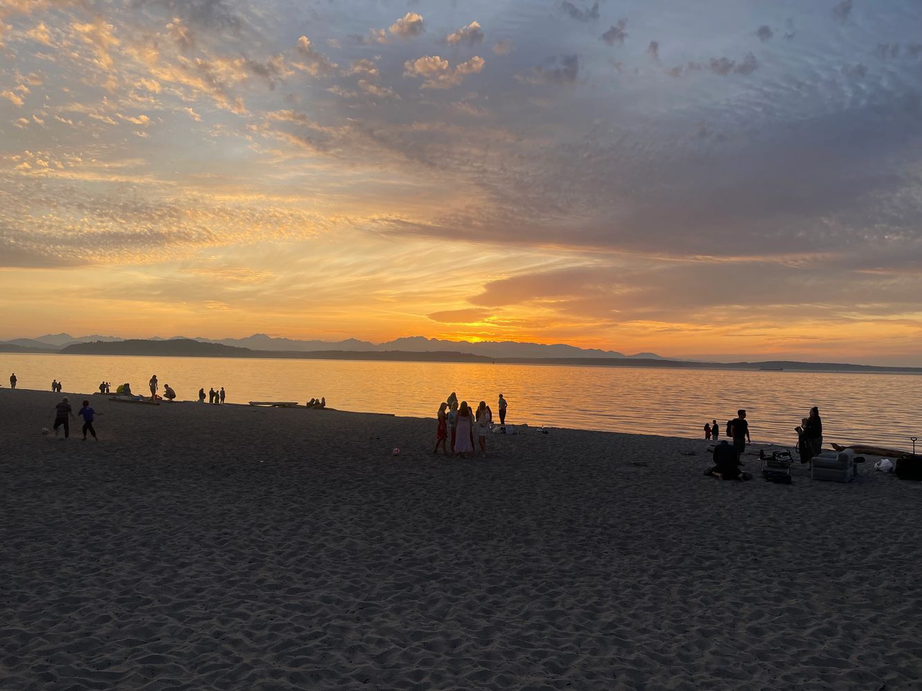 Cascade mountains at sunset from Alki Beach.