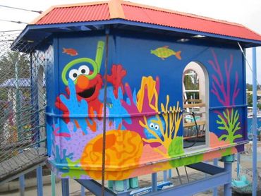 Elmo swims with his fish friends underwater in this mural, painted for SeaWorld San Diego.