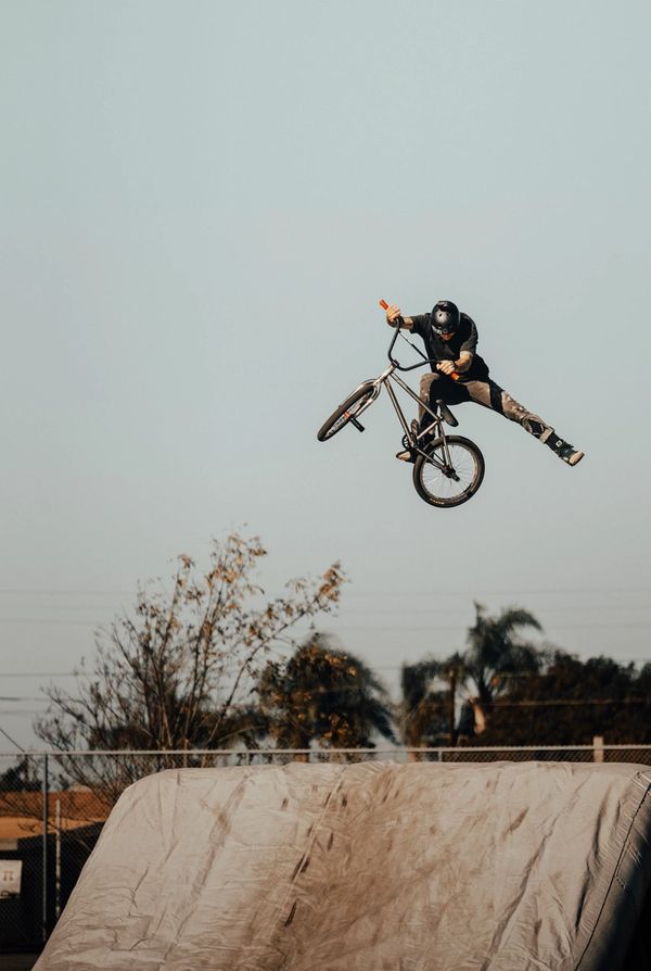 bmx bike rider doing an air trick