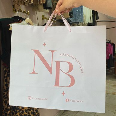 Bolsas de papel couche personalizadas con asas de listón para tu marca