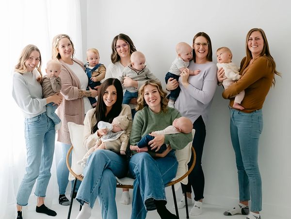 Moms holding babies in a mom group 